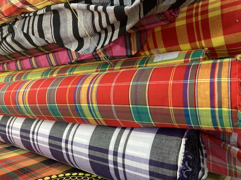 Rolls of checked and striped woven fabric